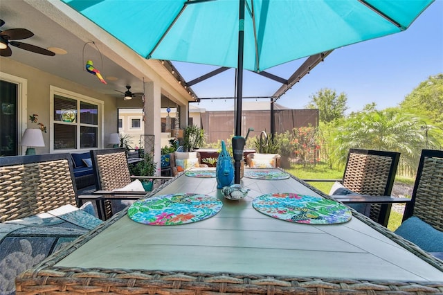 exterior space with outdoor dining area, a patio area, and ceiling fan