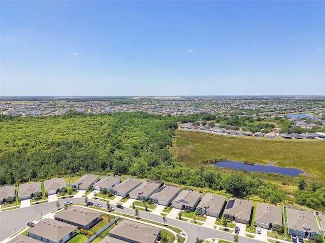 drone / aerial view with a residential view and a water view