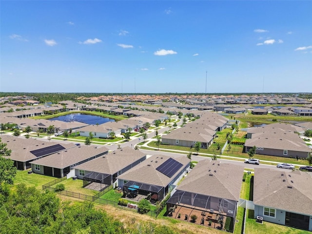 bird's eye view with a water view and a residential view