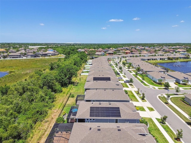 aerial view featuring a residential view and a water view