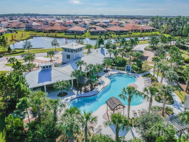 bird's eye view featuring a residential view and a water view