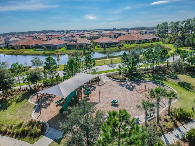birds eye view of property with a residential view and a water view