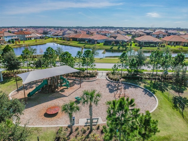bird's eye view featuring a residential view and a water view