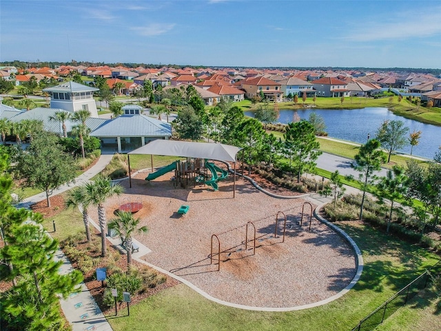 bird's eye view with a residential view and a water view