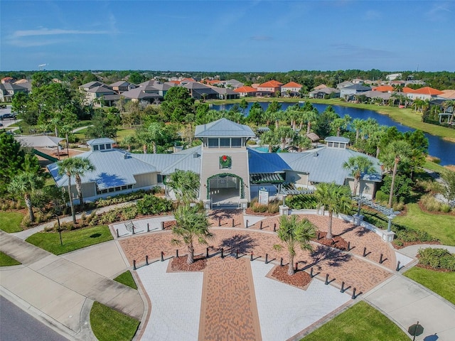 drone / aerial view with a residential view and a water view
