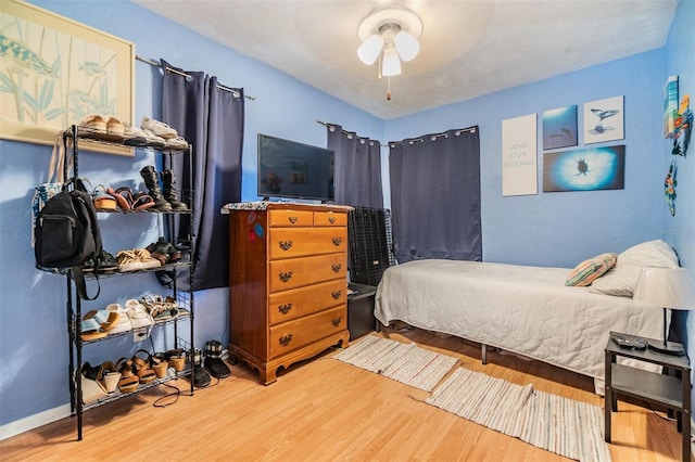 5101 13th Ave S, Gulfport, FL 33707 - bedroom with a ceiling fan and wood finished floors