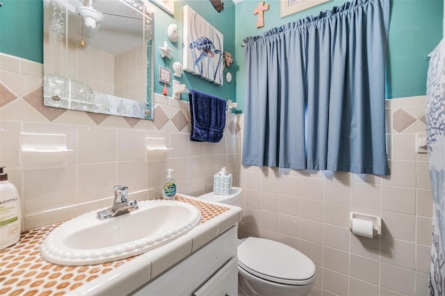 5101 13th Ave S, Gulfport, FL 33707 - bathroom with tile walls, vanity, and toilet