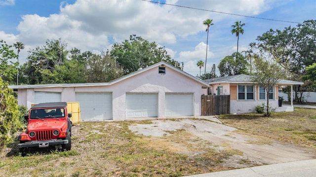 5101 13th Ave S, Gulfport, FL 33707 - ranch-style home featuring a detached garage, fence, and stucco siding