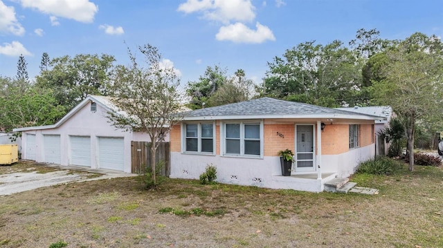 5101 13th Ave S, Gulfport, FL 33707 - view of front of house featuring a garage, fence, and stucco siding