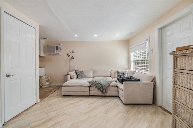 5101 13th Ave S, Gulfport, FL 33707 - living area with an AC wall unit, recessed lighting, baseboards, and visible vents