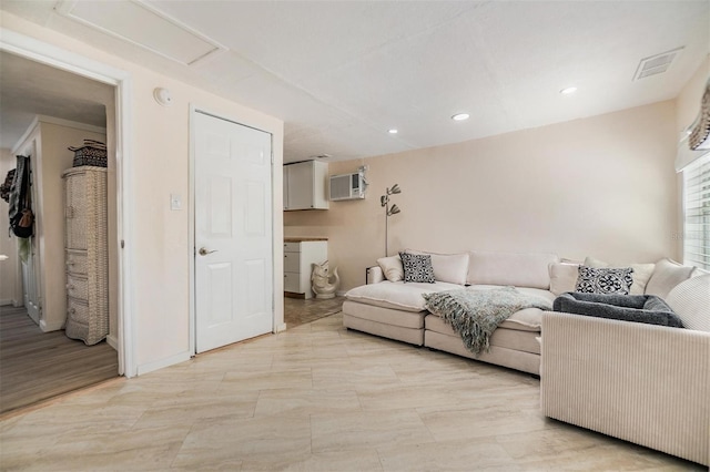 5101 13th Ave S, Gulfport, FL 33707 - living area featuring visible vents, baseboards, a wall mounted air conditioner, attic access, and recessed lighting