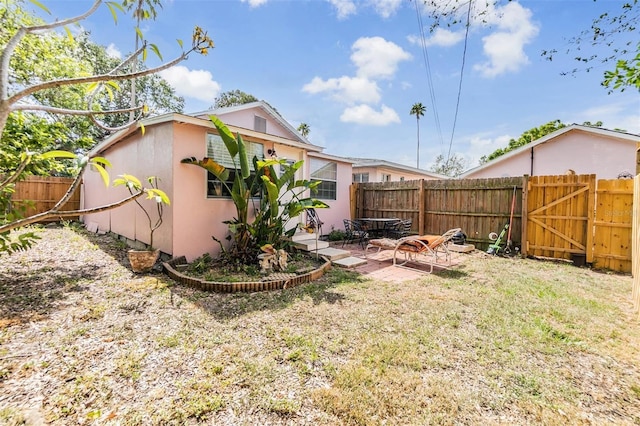 5101 13th Ave S, Gulfport, FL 33707 - view of yard with a patio, a gate, and a fenced backyard