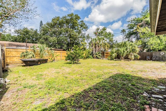 5101 13th Ave S, Gulfport, FL 33707 - view of yard featuring a fenced backyard