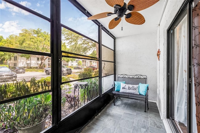 1281 Pine Ridge Cir E Unit H1, Tarpon Springs, FL 34688 - sunroom with plenty of natural light and ceiling fan