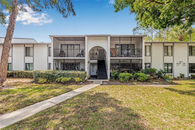 1281 Pine Ridge Cir E Unit H1, Tarpon Springs, FL 34688 - view of property featuring stairs