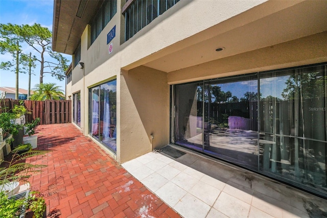 710 N Village Dr N Unit 102, Saint Petersburg, FL 33716 - view of patio with fence