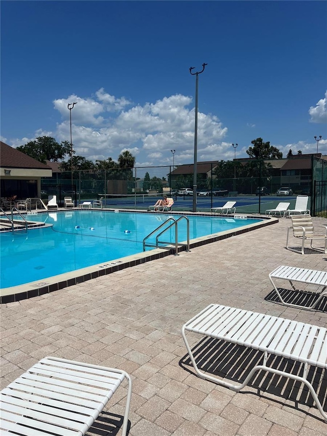 710 N Village Dr N Unit 102, Saint Petersburg, FL 33716 - community pool with fence and a patio