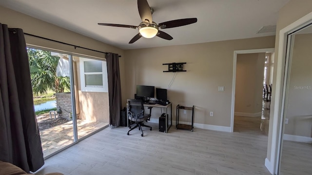 4872 Silverthorne Ct, Oldsmar, FL 34677 - home office with ceiling fan, wood finished floors, and baseboards