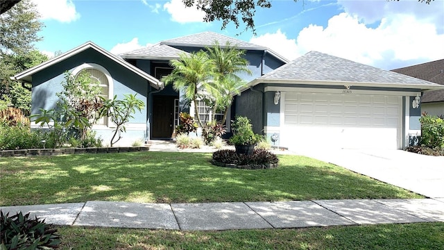 single story home with an attached garage, a front lawn, stucco siding, and driveway