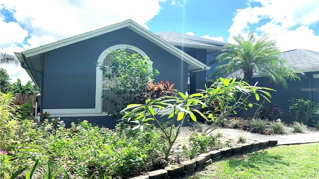 view of side of property with stucco siding