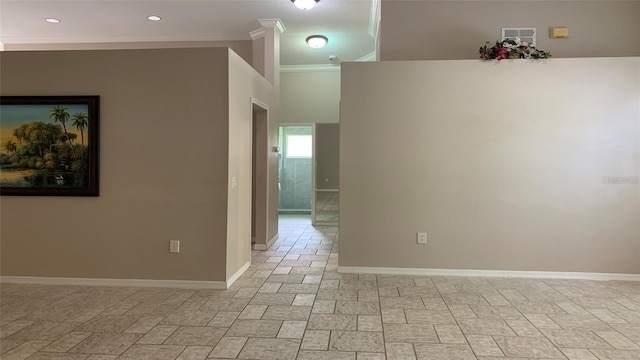 empty room featuring baseboards, ornamental molding, and recessed lighting