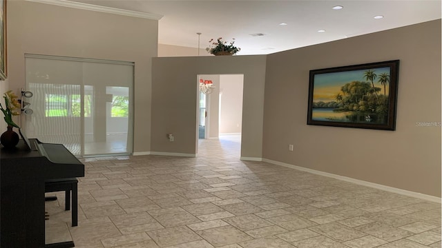 spare room featuring crown molding, recessed lighting, baseboards, stone finish flooring, and visible vents