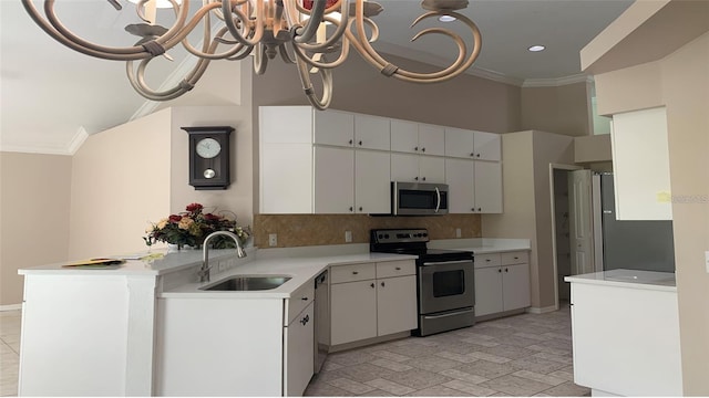 kitchen featuring crown molding, appliances with stainless steel finishes, a sink, and light countertops