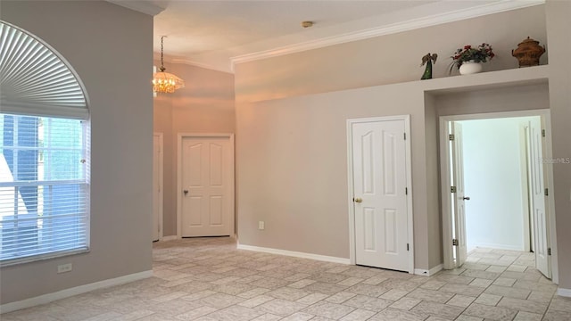 unfurnished room with crown molding, baseboards, and a healthy amount of sunlight