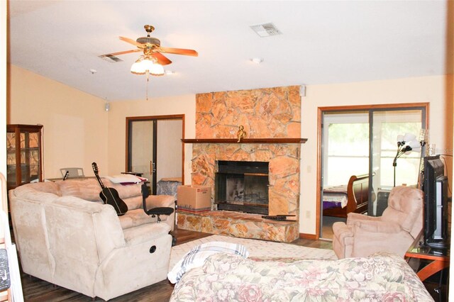 16536 Caldwell Ln, Spring Hill, FL 34610 - living area featuring ceiling fan, visible vents, wood finished floors, and a fireplace