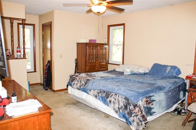 16536 Caldwell Ln, Spring Hill, FL 34610 - bedroom with baseboards, ceiling fan, and carpet