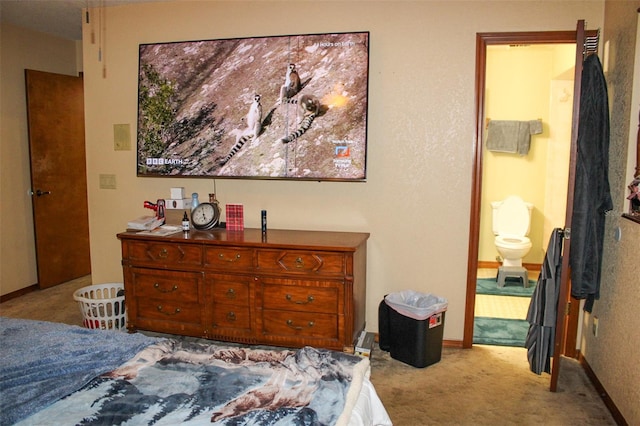 16536 Caldwell Ln, Spring Hill, FL 34610 - bedroom with carpet floors, baseboards, and ensuite bath