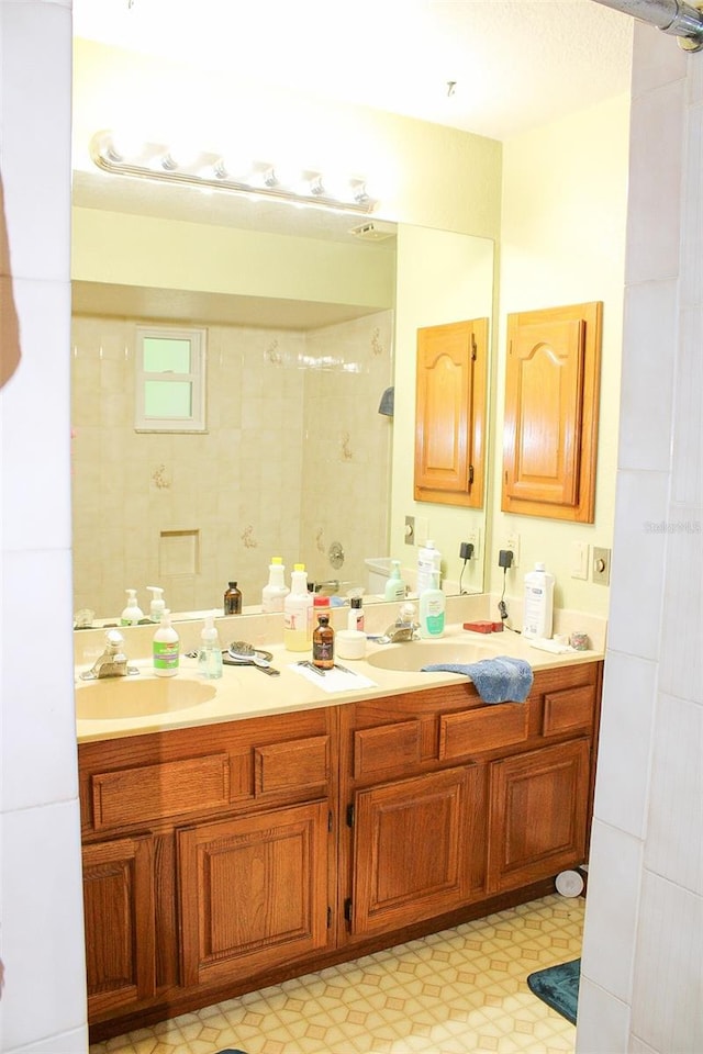 16536 Caldwell Ln, Spring Hill, FL 34610 - bathroom featuring a sink, walk in shower, and double vanity