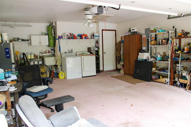16536 Caldwell Ln, Spring Hill, FL 34610 - garage with a garage door opener, freestanding refrigerator, ceiling fan, and washer and clothes dryer
