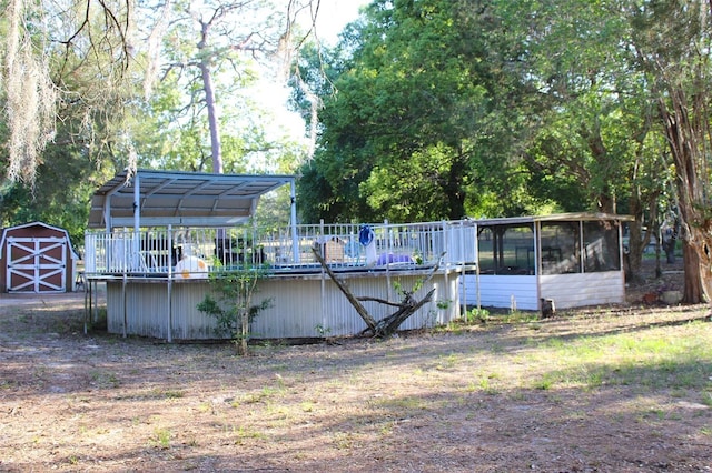 16536 Caldwell Ln, Spring Hill, FL 34610 - view of pool with an outdoor structure, a sunroom, and a shed