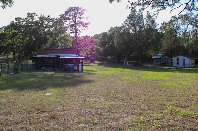 16536 Caldwell Ln, Spring Hill, FL 34610 - view of yard with fence and an outbuilding