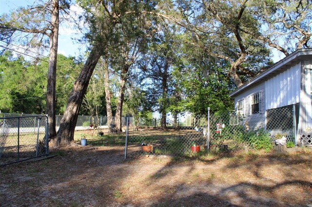 16536 Caldwell Ln, Spring Hill, FL 34610 - view of yard featuring fence