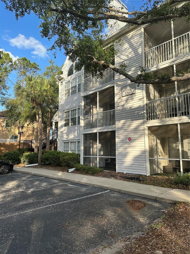 3260 Haviland Ct Unit 202, Palm Harbor, FL 34684 - view of building exterior featuring uncovered parking