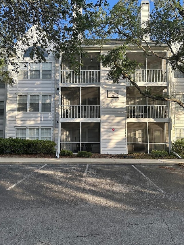 3260 Haviland Ct Unit 202, Palm Harbor, FL 34684 - view of property featuring uncovered parking
