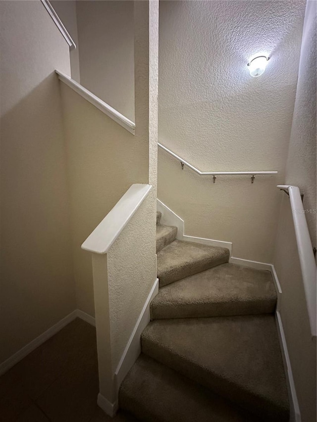 3260 Haviland Ct Unit 202, Palm Harbor, FL 34684 - stairs with baseboards