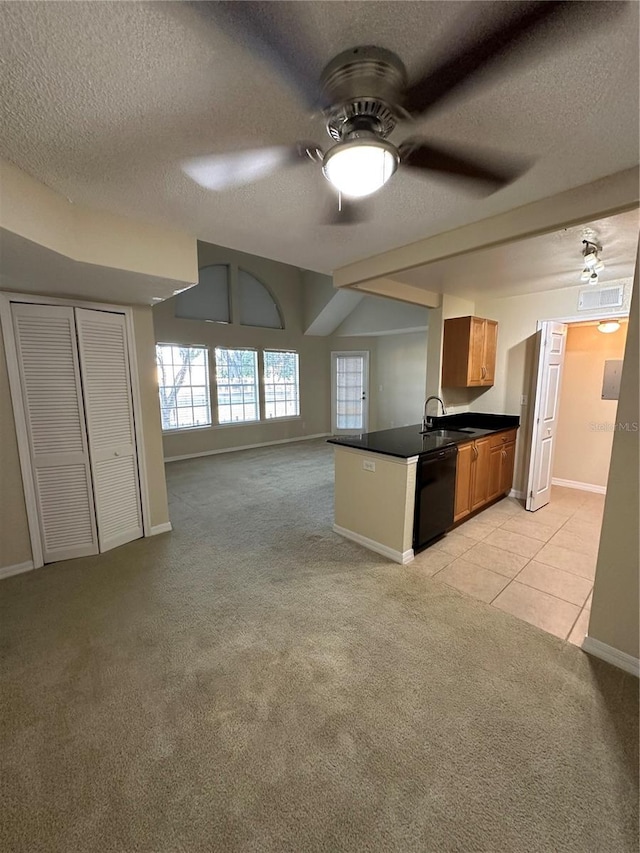 3260 Haviland Ct Unit 202, Palm Harbor, FL 34684 - kitchen featuring ceiling fan, a textured ceiling, dark countertops, light carpet, and black dishwasher