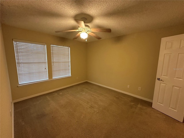 3260 Haviland Ct Unit 202, Palm Harbor, FL 34684 - spare room featuring carpet flooring, a textured ceiling, ceiling fan, and baseboards