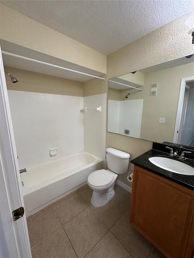 3260 Haviland Ct Unit 202, Palm Harbor, FL 34684 - full bathroom with tile patterned flooring, vanity, toilet, a textured ceiling, and shower / bathing tub combination