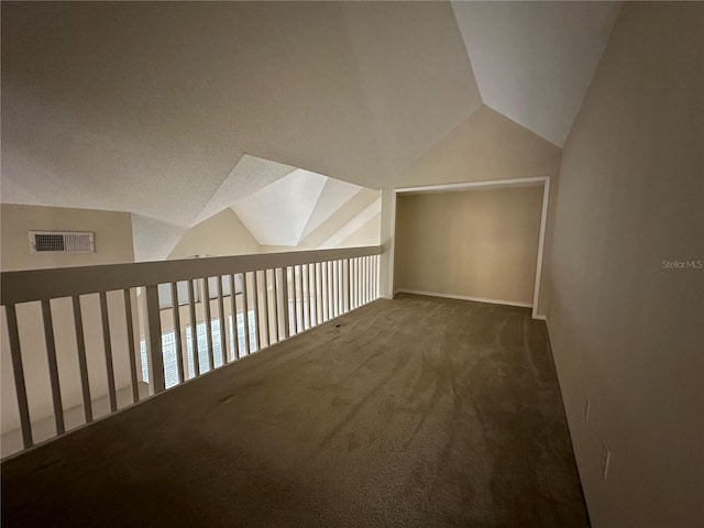 3260 Haviland Ct Unit 202, Palm Harbor, FL 34684 - additional living space with baseboards, vaulted ceiling, carpet flooring, and visible vents