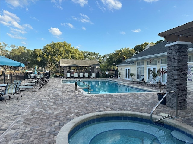 3260 Haviland Ct Unit 202, Palm Harbor, FL 34684 - pool with a patio area, a hot tub, and fence