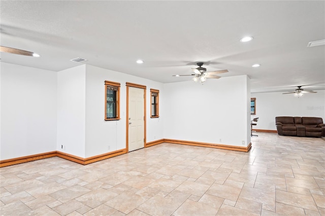 unfurnished room featuring a ceiling fan, recessed lighting, and baseboards