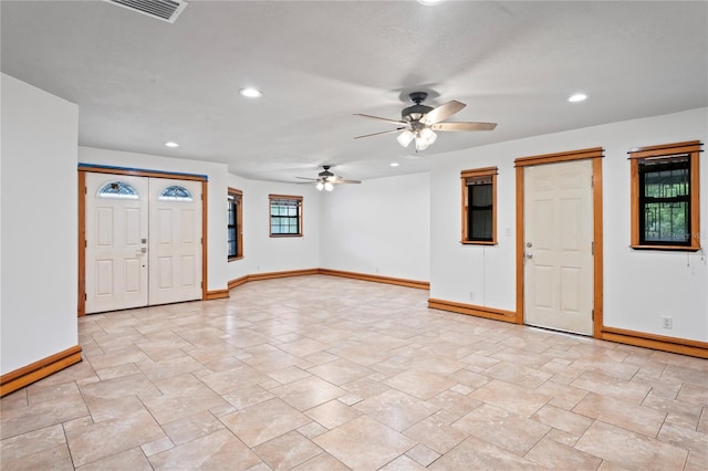 foyer with baseboards, a ceiling fan, recessed lighting, and light stone finish flooring
