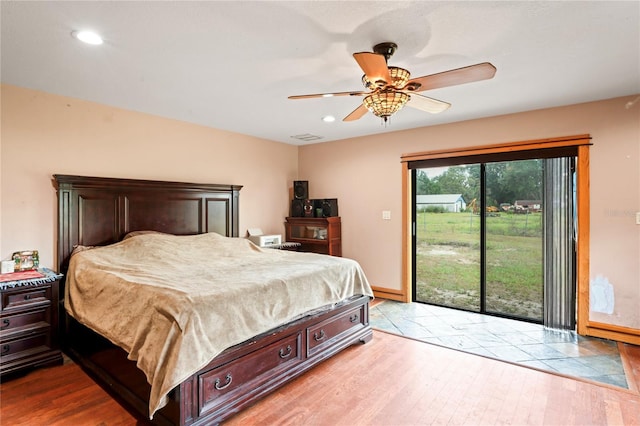 bedroom featuring wood finished floors, access to exterior, recessed lighting, baseboards, and a ceiling fan