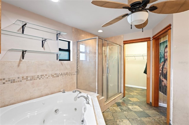 bathroom with a shower stall, a whirlpool tub, a spacious closet, a ceiling fan, and recessed lighting