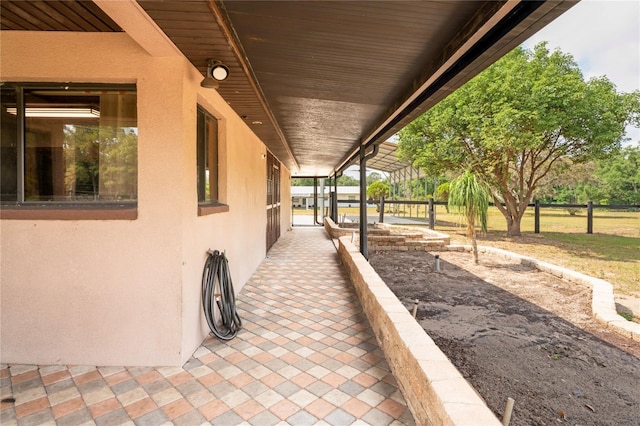 view of patio / terrace featuring fence