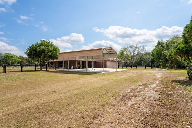 view of yard with a detached carport